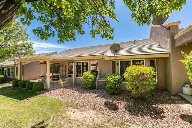2078 Joy Creek Ln, Henderson, NV 89012 - back of property with stucco siding, a tiled roof, a patio, a ceiling fan, and a pergola