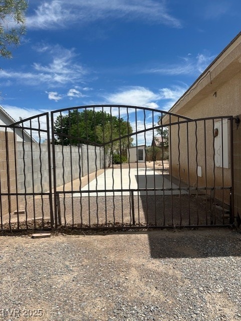 view of gate featuring fence