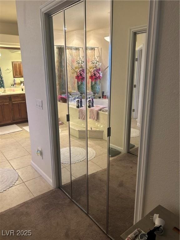 interior space featuring carpet floors and baseboards