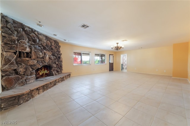 711 Sari Dr, Las Vegas, NV 89110 - unfurnished living room with a chandelier, light tile patterned flooring, and a fireplace