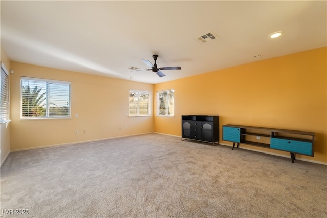 711 Sari Dr, Las Vegas, NV 89110 - unfurnished living room featuring healthy amount of natural light, carpet, a ceiling fan, and recessed lighting