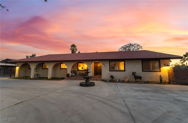 711 Sari Dr, Las Vegas, NV 89110 - view of front of property featuring stucco siding and a tiled roof