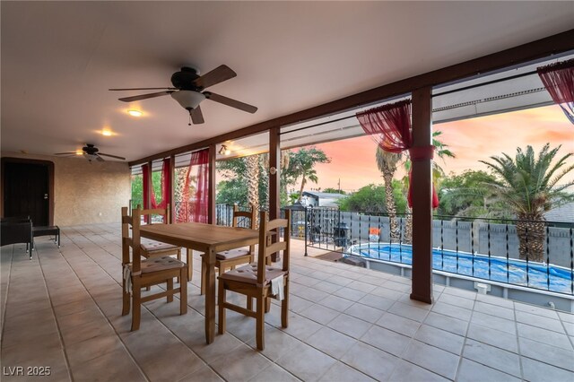 711 Sari Dr, Las Vegas, NV 89110 - patio terrace at dusk featuring a ceiling fan, a patio, and outdoor dining space