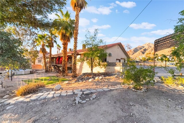 711 Sari Dr, Las Vegas, NV 89110 - view of front of property with stucco siding and a mountain view