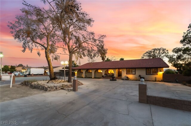 711 Sari Dr, Las Vegas, NV 89110 - ranch-style house with curved driveway and stucco siding