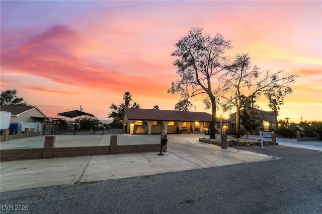 711 Sari Dr, Las Vegas, NV 89110 - view of front of home featuring curved driveway and a detached carport