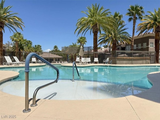 pool featuring a patio and fence
