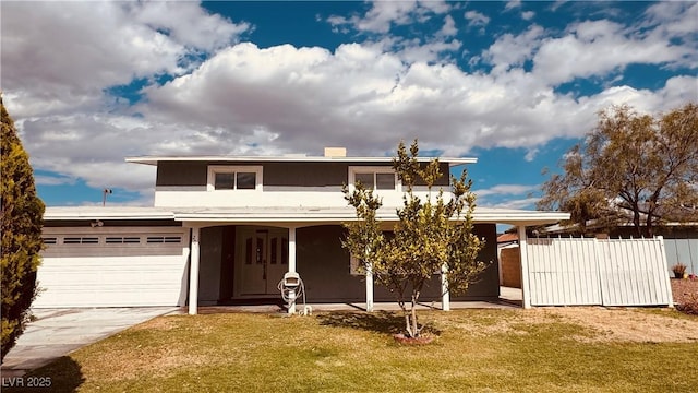 201 Redstone St, Las Vegas, NV 89145 - traditional-style home featuring a front lawn, an attached garage, concrete driveway, stucco siding, and fence