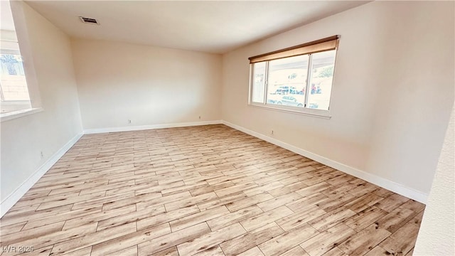 201 Redstone St, Las Vegas, NV 89145 - spare room featuring plenty of natural light, light wood finished floors, and baseboards