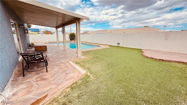 201 Redstone St, Las Vegas, NV 89145 - view of swimming pool featuring a lawn, a patio area, and a fenced backyard