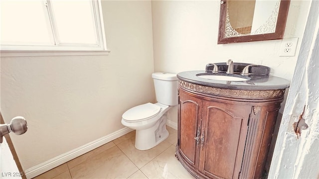 201 Redstone St, Las Vegas, NV 89145 - bathroom with toilet, tile patterned flooring, vanity, and baseboards