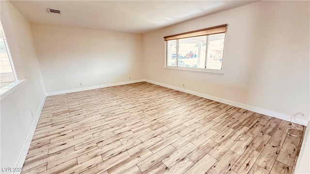 201 Redstone St, Las Vegas, NV 89145 - spare room featuring visible vents, light wood-style flooring, and baseboards