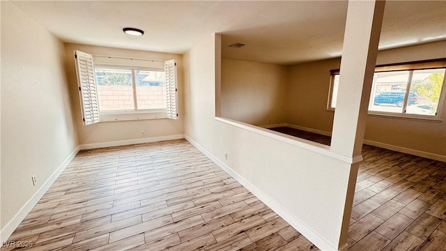 201 Redstone St, Las Vegas, NV 89145 - spare room with visible vents, wood finished floors, and baseboards