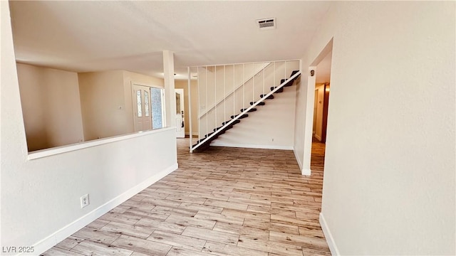 201 Redstone St, Las Vegas, NV 89145 - basement with stairs, visible vents, wood finished floors, and baseboards