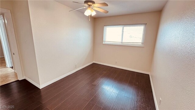 201 Redstone St, Las Vegas, NV 89145 - unfurnished room with a ceiling fan, dark wood finished floors, and baseboards