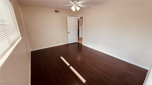 201 Redstone St, Las Vegas, NV 89145 - spare room with dark wood-type flooring, visible vents, a ceiling fan, and baseboards