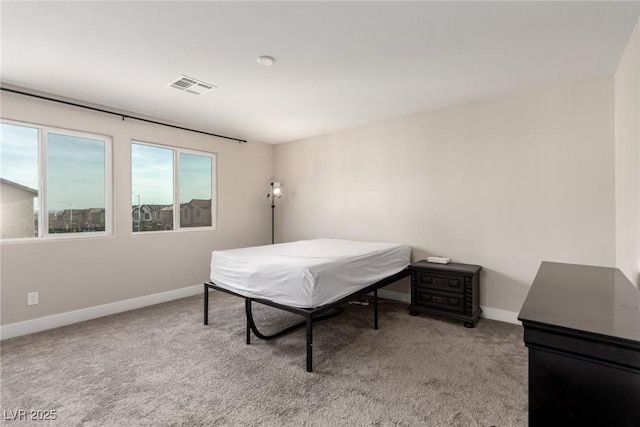 1049 Williamtown Ave, North Las Vegas, NV 89084 - bedroom with visible vents, light carpet, and baseboards