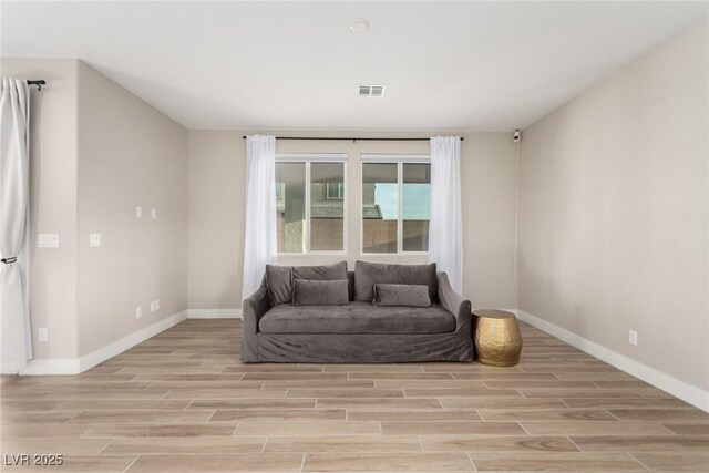 1049 Williamtown Ave, North Las Vegas, NV 89084 - sitting room with visible vents, light wood-type flooring, and baseboards