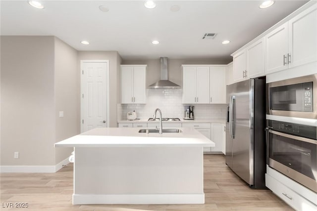 1049 Williamtown Ave, North Las Vegas, NV 89084 - kitchen with wall chimney range hood, decorative backsplash, appliances with stainless steel finishes, visible vents, and light countertops