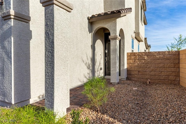 1049 Williamtown Ave, North Las Vegas, NV 89084 - property entrance with stucco siding and fence