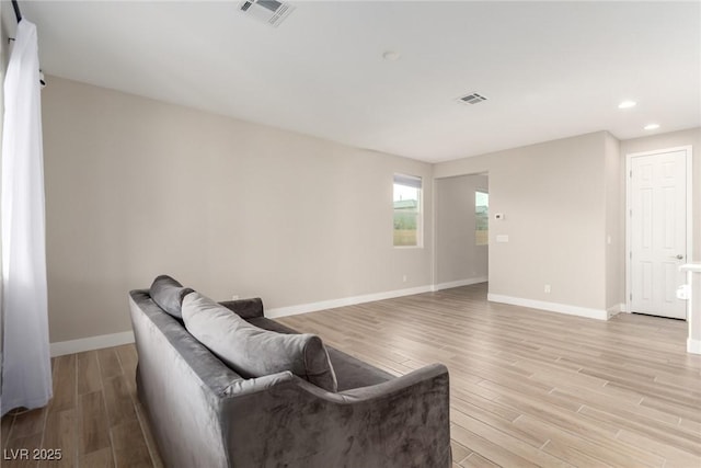 1049 Williamtown Ave, North Las Vegas, NV 89084 - living room with visible vents, baseboards, recessed lighting, and light wood-style floors