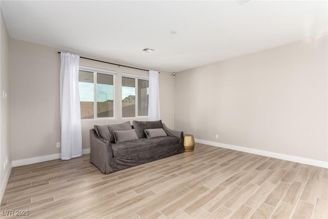 1049 Williamtown Ave, North Las Vegas, NV 89084 - living room with visible vents, light wood finished floors, and baseboards