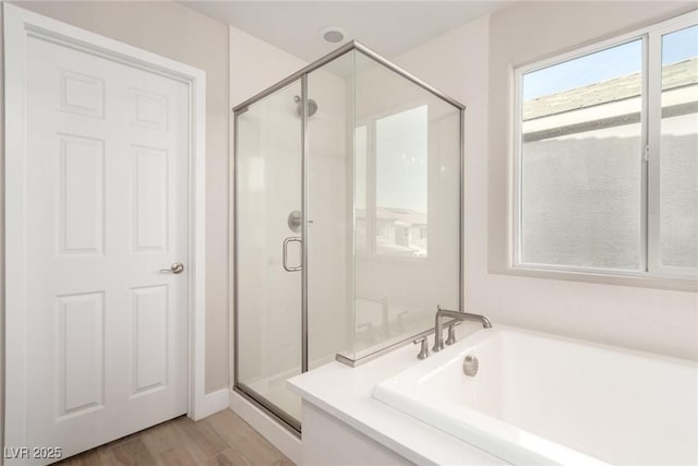 1049 Williamtown Ave, North Las Vegas, NV 89084 - full bath featuring wood finished floors, a stall shower, and a bath