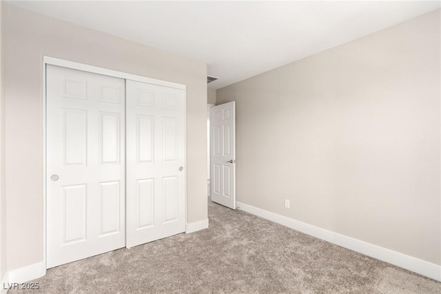 1049 Williamtown Ave, North Las Vegas, NV 89084 - unfurnished bedroom featuring a closet, baseboards, and carpet floors