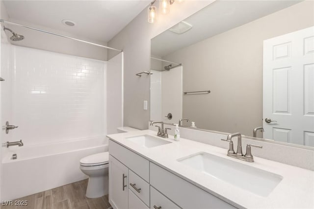1049 Williamtown Ave, North Las Vegas, NV 89084 - bathroom featuring shower / washtub combination, wood finished floors, toilet, and a sink