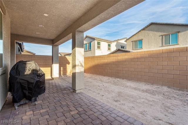 1049 Williamtown Ave, North Las Vegas, NV 89084 - view of patio featuring area for grilling and a fenced backyard