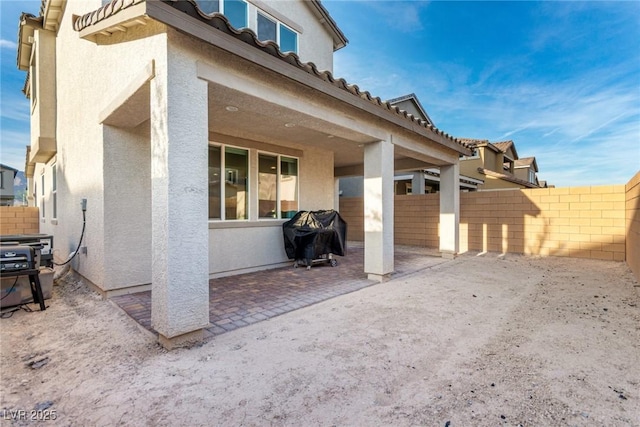1049 Williamtown Ave, North Las Vegas, NV 89084 - view of patio with grilling area and a fenced backyard