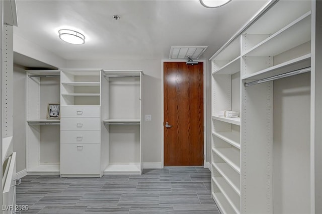 spacious closet featuring visible vents