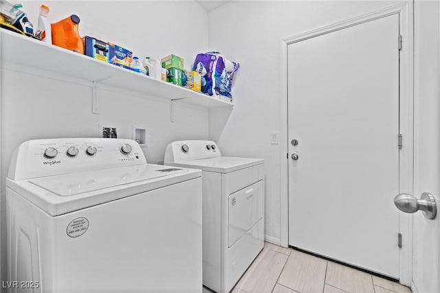 laundry room with washer and dryer and laundry area