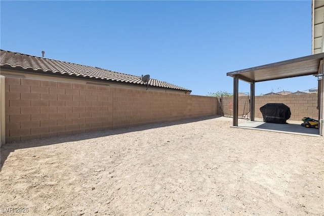 view of yard featuring a patio and a fenced backyard