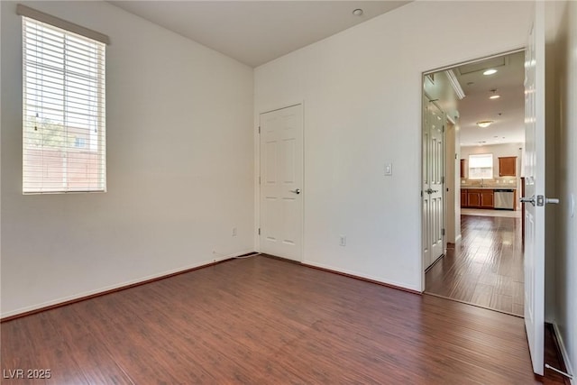 1139 Via Partito, Henderson, NV 89052 - unfurnished room featuring dark wood-type flooring and baseboards