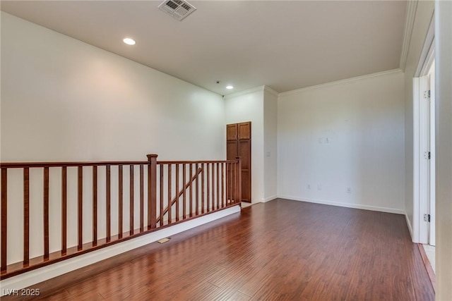 1139 Via Partito, Henderson, NV 89052 - empty room with dark wood-style floors, recessed lighting, ornamental molding, and baseboards
