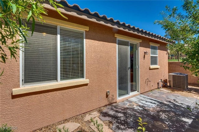 1139 Via Partito, Henderson, NV 89052 - view of side of property featuring stucco siding, central AC unit, a patio, and a tile roof