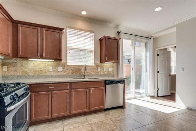 1139 Via Partito, Henderson, NV 89052 - kitchen featuring a sink, appliances with stainless steel finishes, backsplash, light tile patterned floors, and ornamental molding