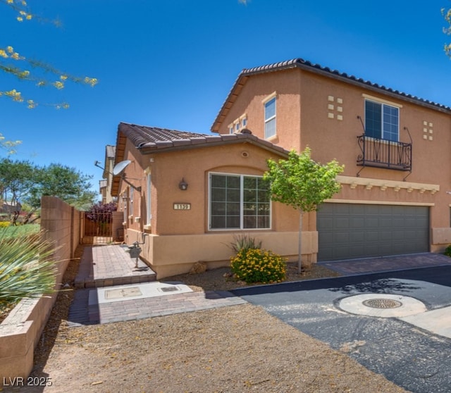 1139 Via Partito, Henderson, NV 89052 - view of front of property featuring a garage, stucco siding, driveway, and a tiled roof