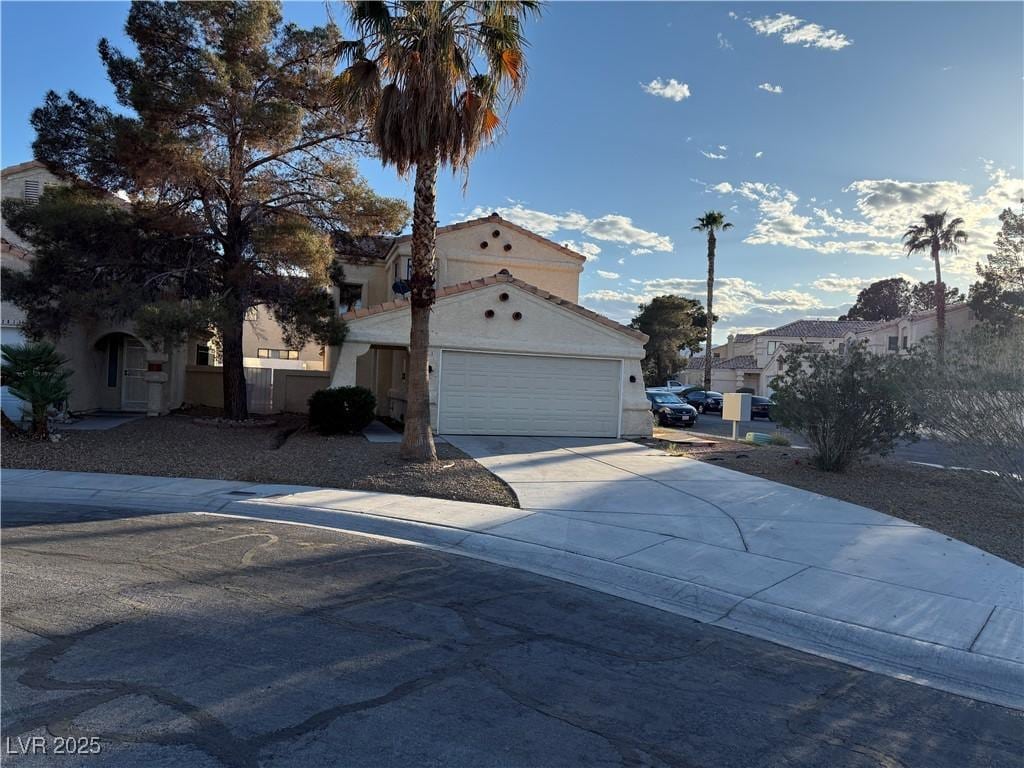 2821 Willow Wind Ct, Las Vegas, NV 89117 - exterior space featuring concrete driveway, an attached garage, and stucco siding