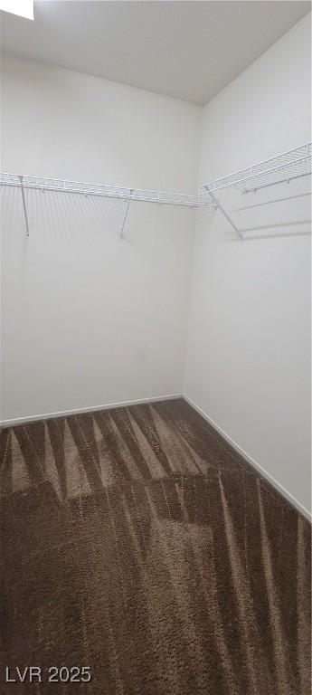 8626 Anderson Dale Ave, Las Vegas, NV 89178 - walk in closet featuring dark colored carpet
