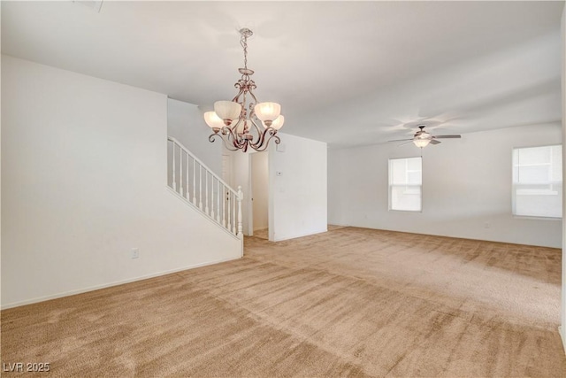 8626 Anderson Dale Ave, Las Vegas, NV 89178 - empty room featuring carpet flooring, stairs, a chandelier, and ceiling fan