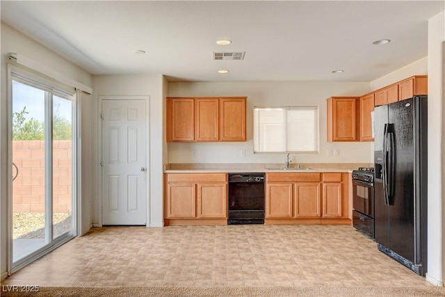 8626 Anderson Dale Ave, Las Vegas, NV 89178 - kitchen featuring black appliances, a sink, light countertops, and light floors