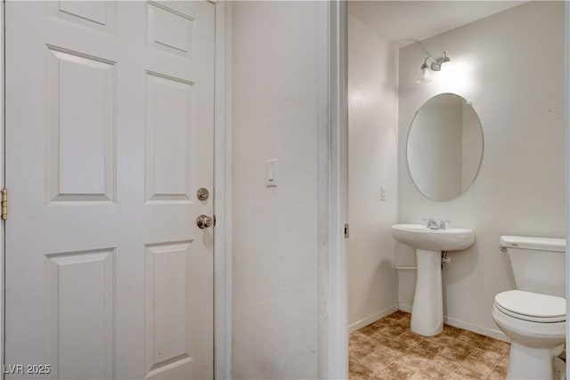 8626 Anderson Dale Ave, Las Vegas, NV 89178 - half bathroom featuring toilet and baseboards