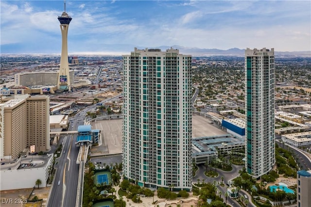 property's view of city featuring a mountain view