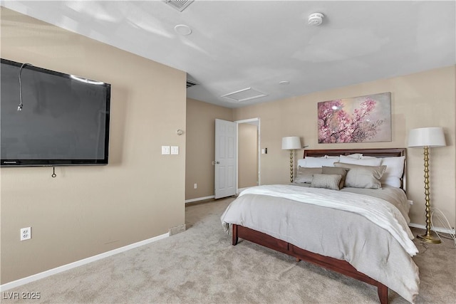 carpeted bedroom with baseboards, attic access, and visible vents