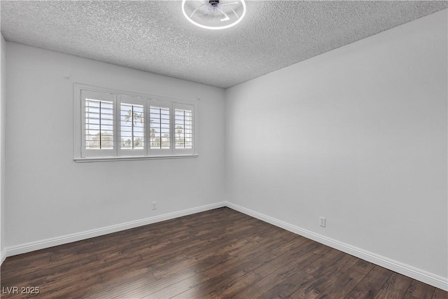 unfurnished room featuring baseboards, a textured ceiling, and dark wood-style flooring