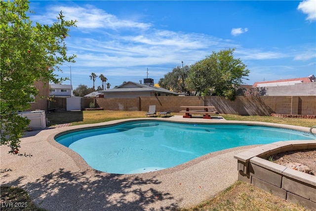 view of swimming pool with a fenced in pool, a fenced backyard, and a patio area