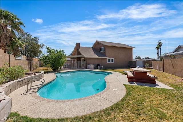 view of pool with a yard, a fenced in pool, a fenced backyard, and a patio area