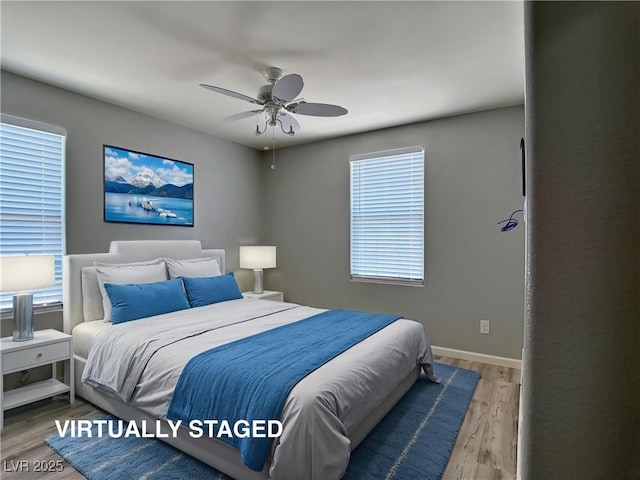 bedroom featuring baseboards, a ceiling fan, and wood finished floors